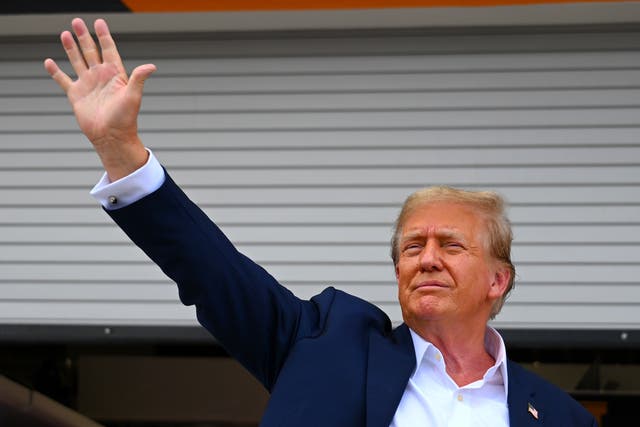 <p>Donald Trump waves to the crowds at the F1 Miami Grand Prix on Sunday 5 May 2024 </p>