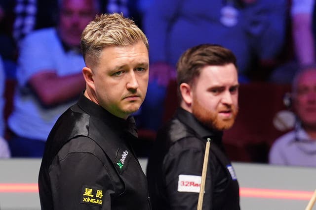 <p>Kyren Wilson (left) leads Jak Jones 11-6 after the first day of the World Snooker Championship final (Mike Egerton/PA)</p>