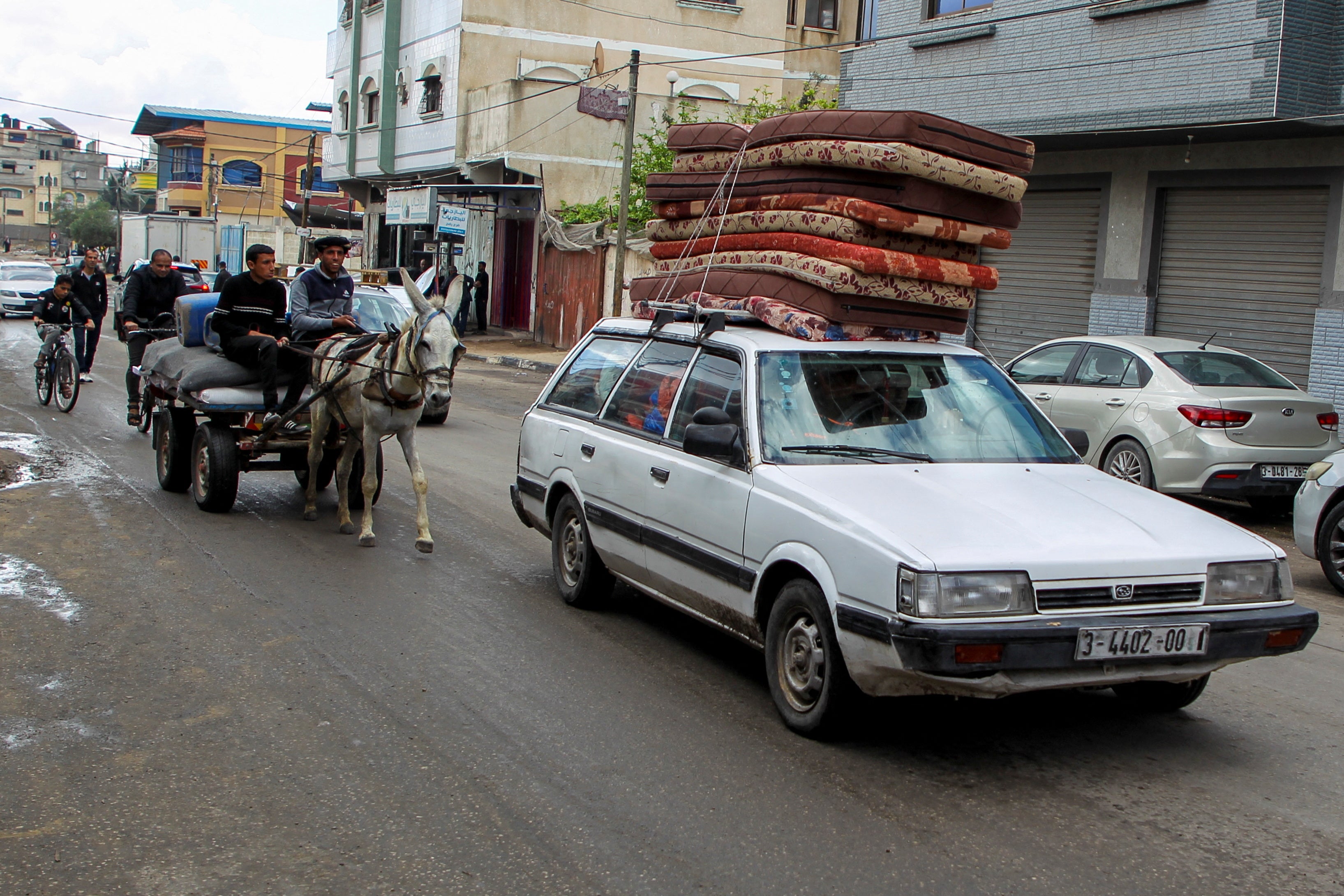 Palestinians leave Rafah by donkey and car to a ‘humanitarian zone’ in a move human rights groups claim is illegal