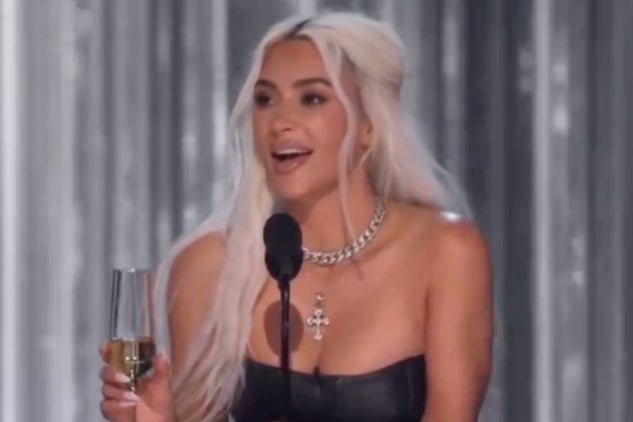 Kim Kardashian on stage at Brady’s roast as the crowd boos her