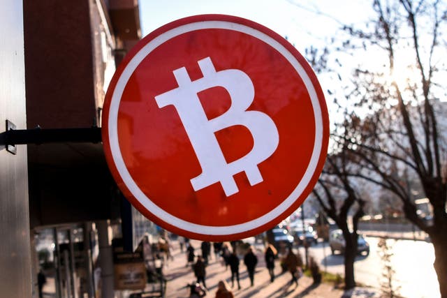 <p>A bitcoin sign displayed at a cryptocurrency exchange shop in Pristina, Kosovo on 17 January, 2022</p>