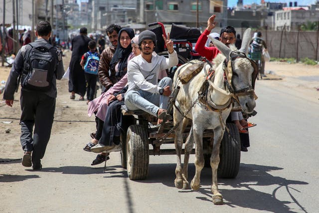 <p>People flee the eastern parts of Rafah after the Israeli military began evacuating Palestinian civilians ahead of a threatened assault</p>