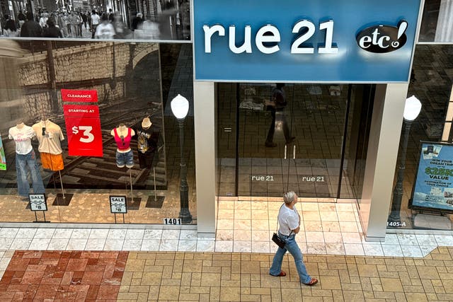 <p>A shopper walks by a rue21 store at Solano Town Center on May 03, 2024 in Fairfield, California</p>