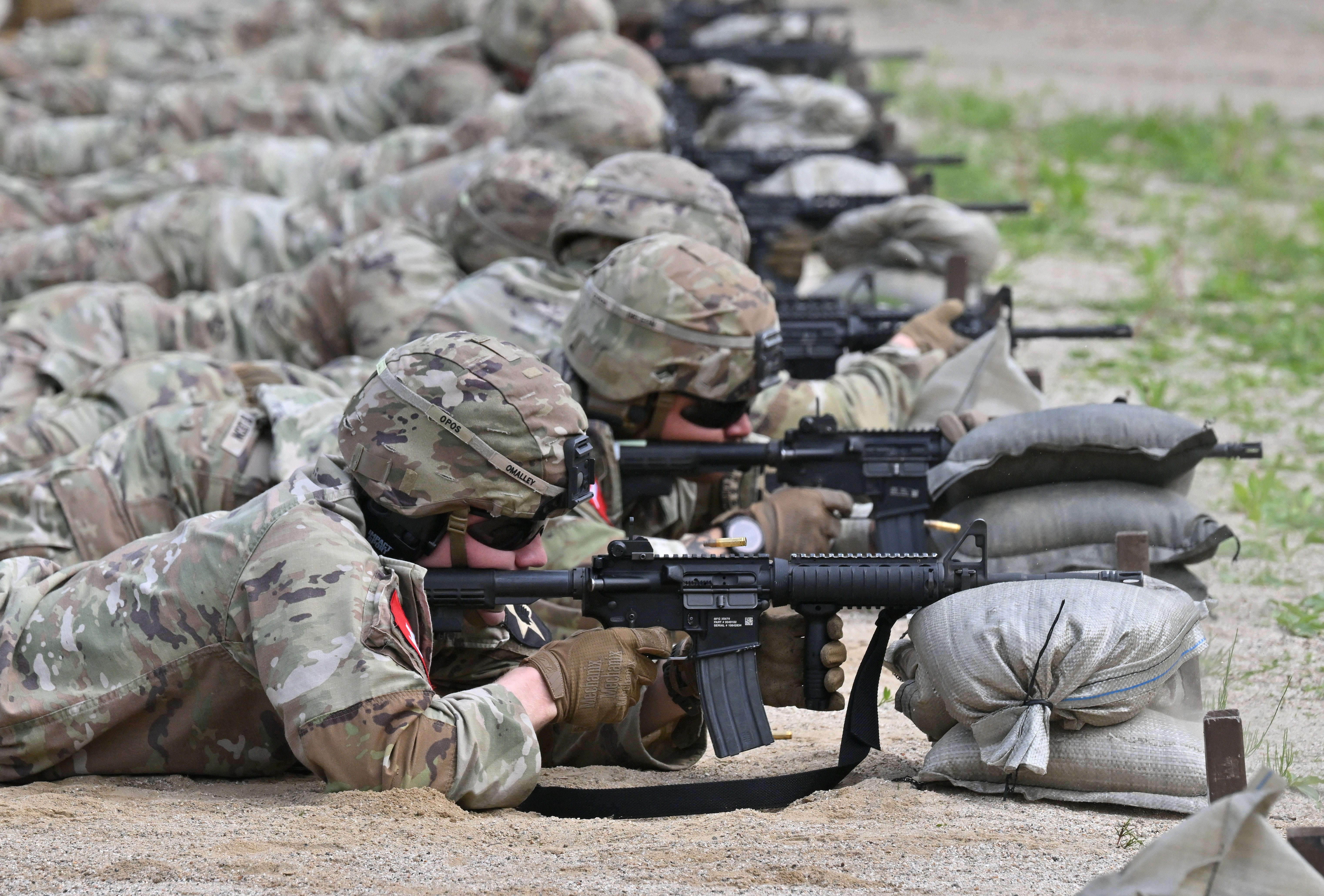 US soldiers aim their rifle at a shooting range during a stress shoot test of the Best Squad Competition conducted by the US 2nd Infantry Division and the ROK-US Combined Division at the US Army's Camp Casey in Dongducheon on May 1, 2024.
