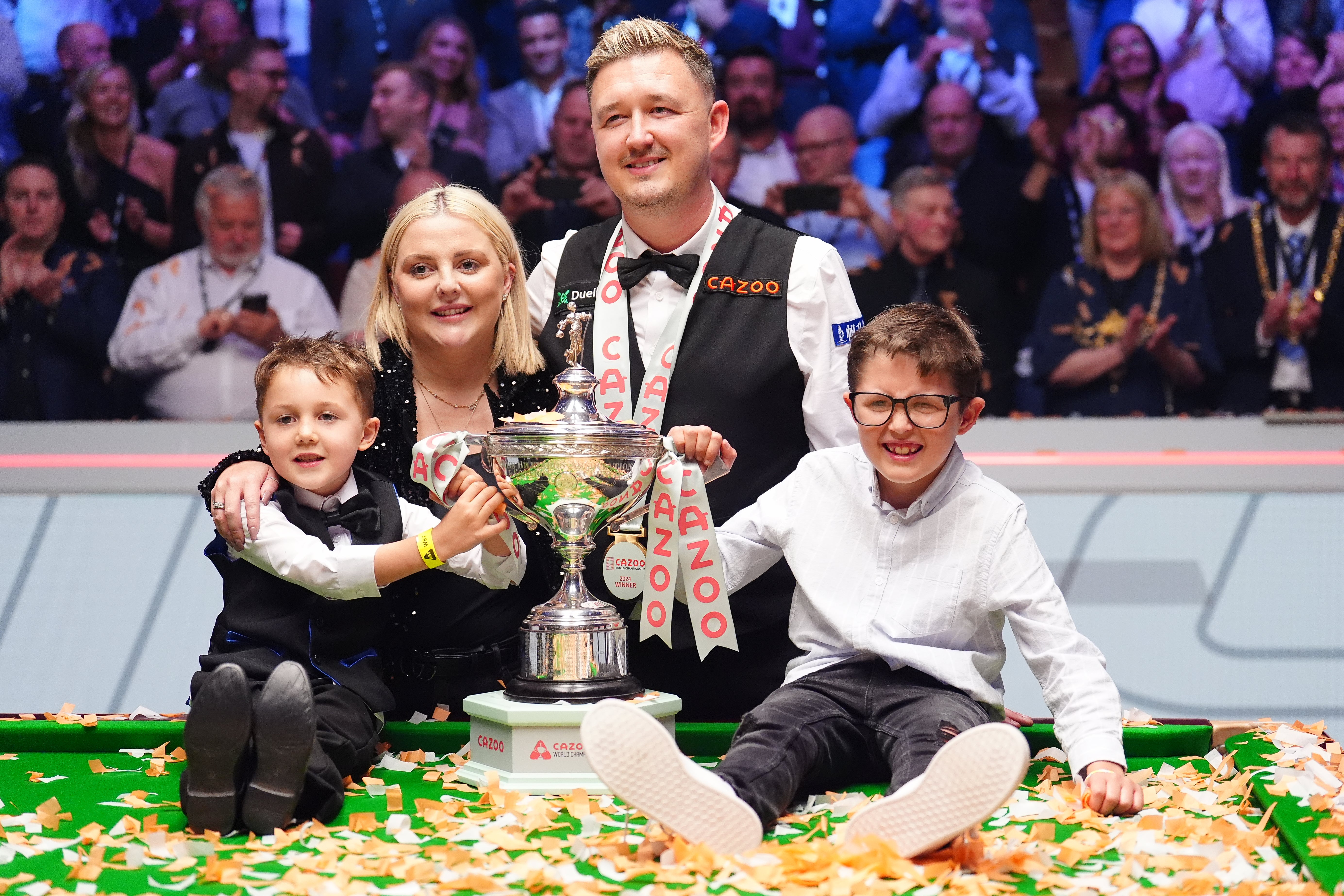 Kyren Wilson celebrates with his wife Sofie and children Finley and Bailey