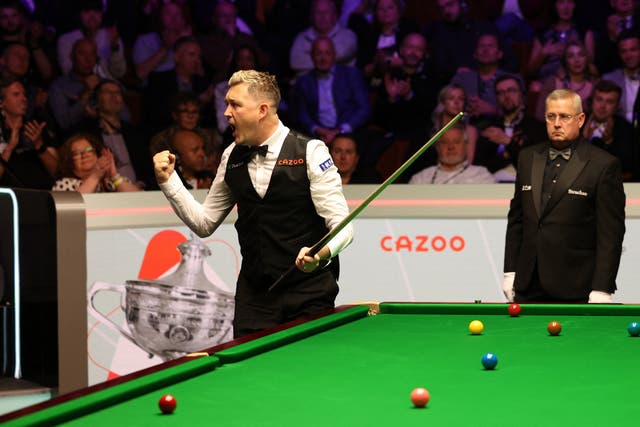 <p>Kyren Wilson celebrates after clinching his first world title</p>