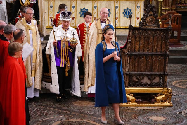 Lord President of the Council, Penny Mordaunt, holding the Sword of State walking ahead of the King during his coronation ceremony (Yui Mok/PA)