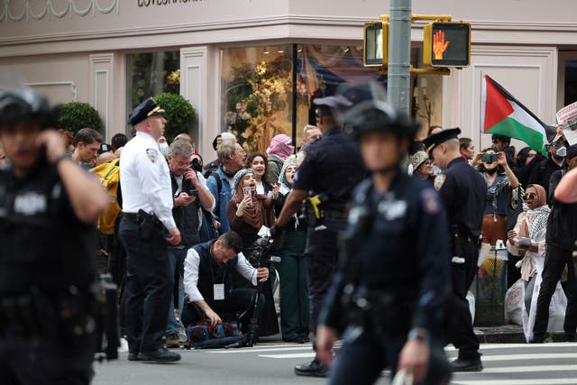 <p>Police watch pro-Palestinian demonstrators near the Met Gala at the Metropolitan Museum of Art on May 6, 2024 in New York</p>
