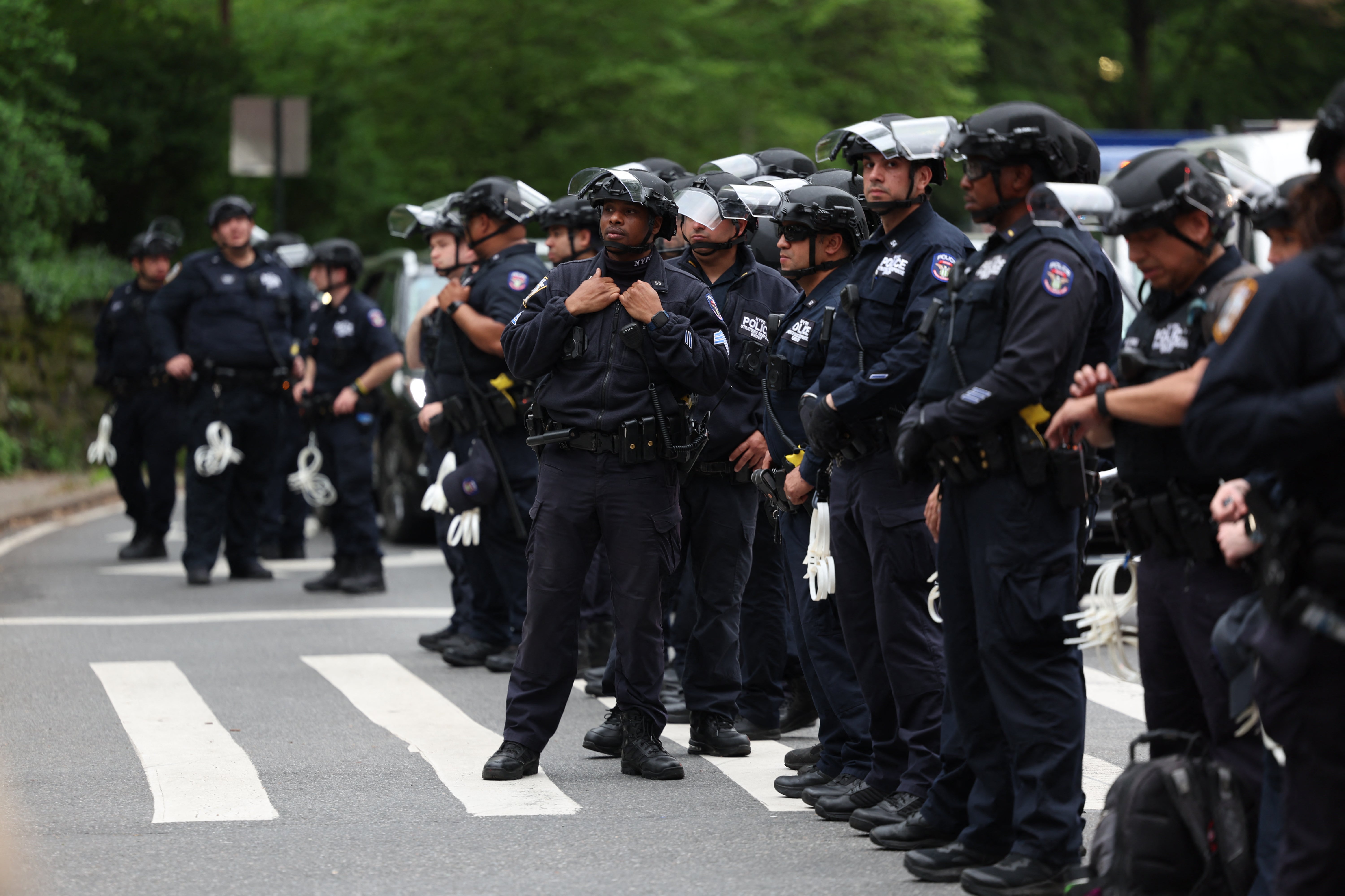 Police watch pro-Palestinian demonstrators near the Met Gala at the Metropolitan Museum of Art on May 6, 2024 in New York