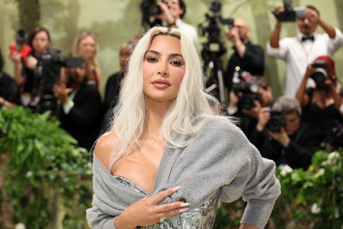 Kim Kardashian reveals why she wore a cardigan to the Met Gala after stunning her fans