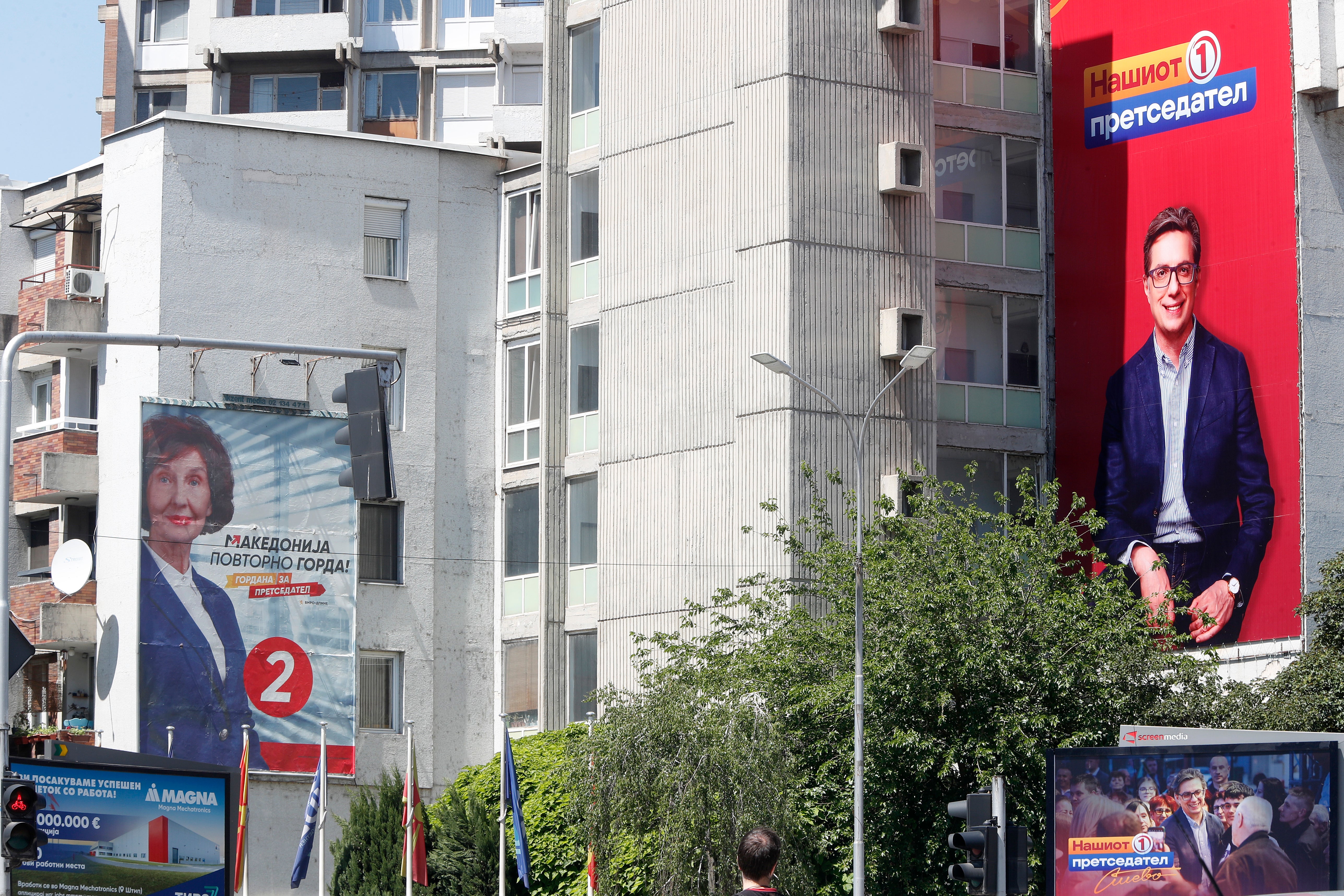 Giant posters of Gordana Siljanovska Davkova, the presidential candidate supported by the center-right main opposition VMRO-DPMNE coalition, left and Stevo Pendarovski, incumbent President and the presidential candidate backed by the ruling social democrats (SDSM), right, are hanging on a building in Skopje, North Macedonia, on Monday, May 6, 2024