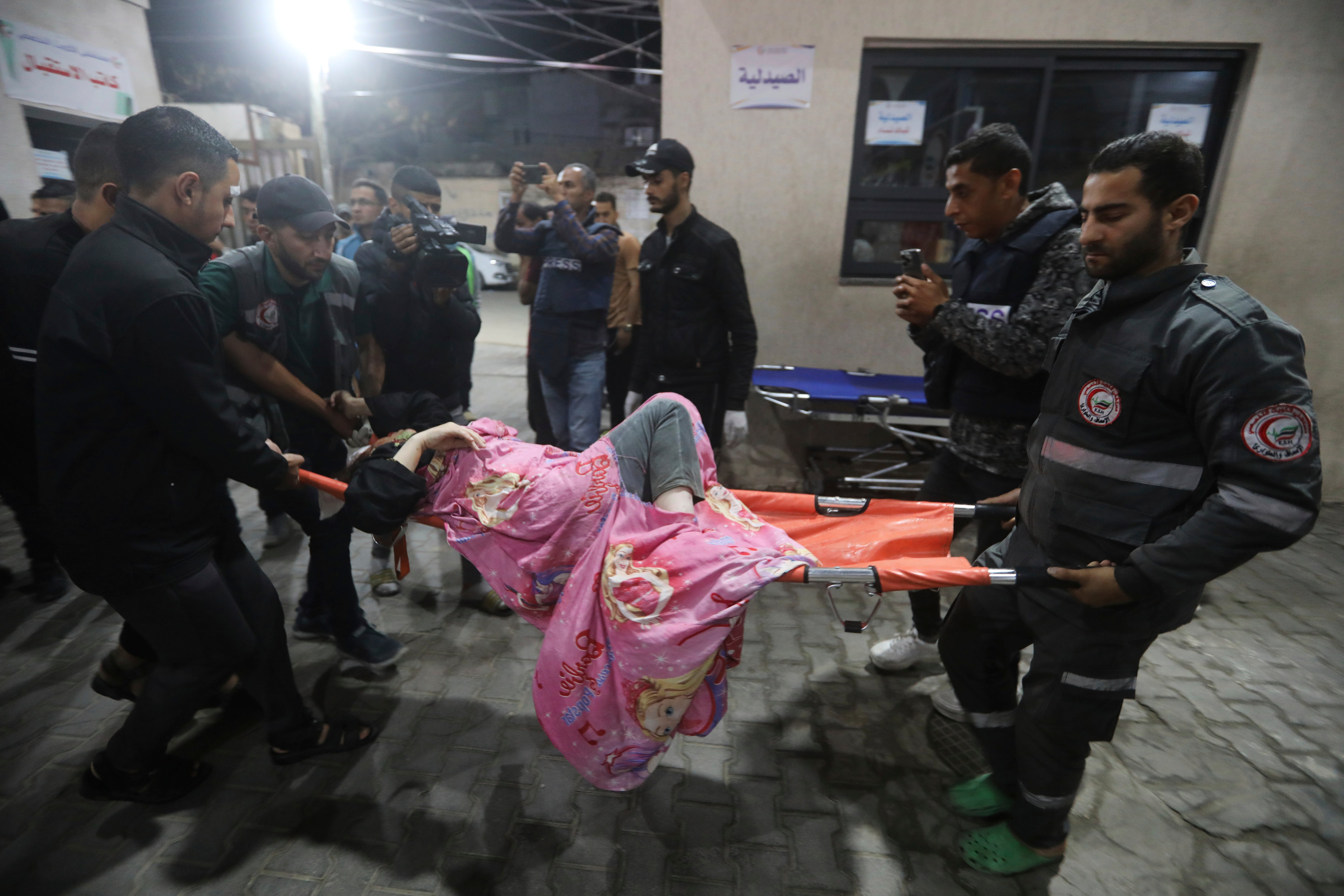 A Palestinian wounded in the Israeli bombardment of the Gaza Strip is brought to a hospital in Rafah, southern Gaza Strip