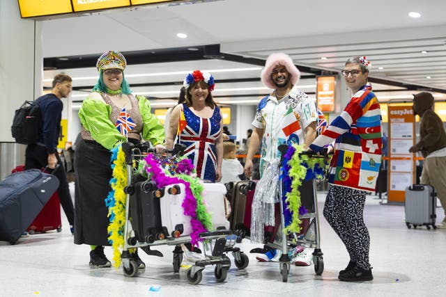 <p>Eurovision fans prepare to board a special party flight from Gatwick (David Parry/PA)</p>