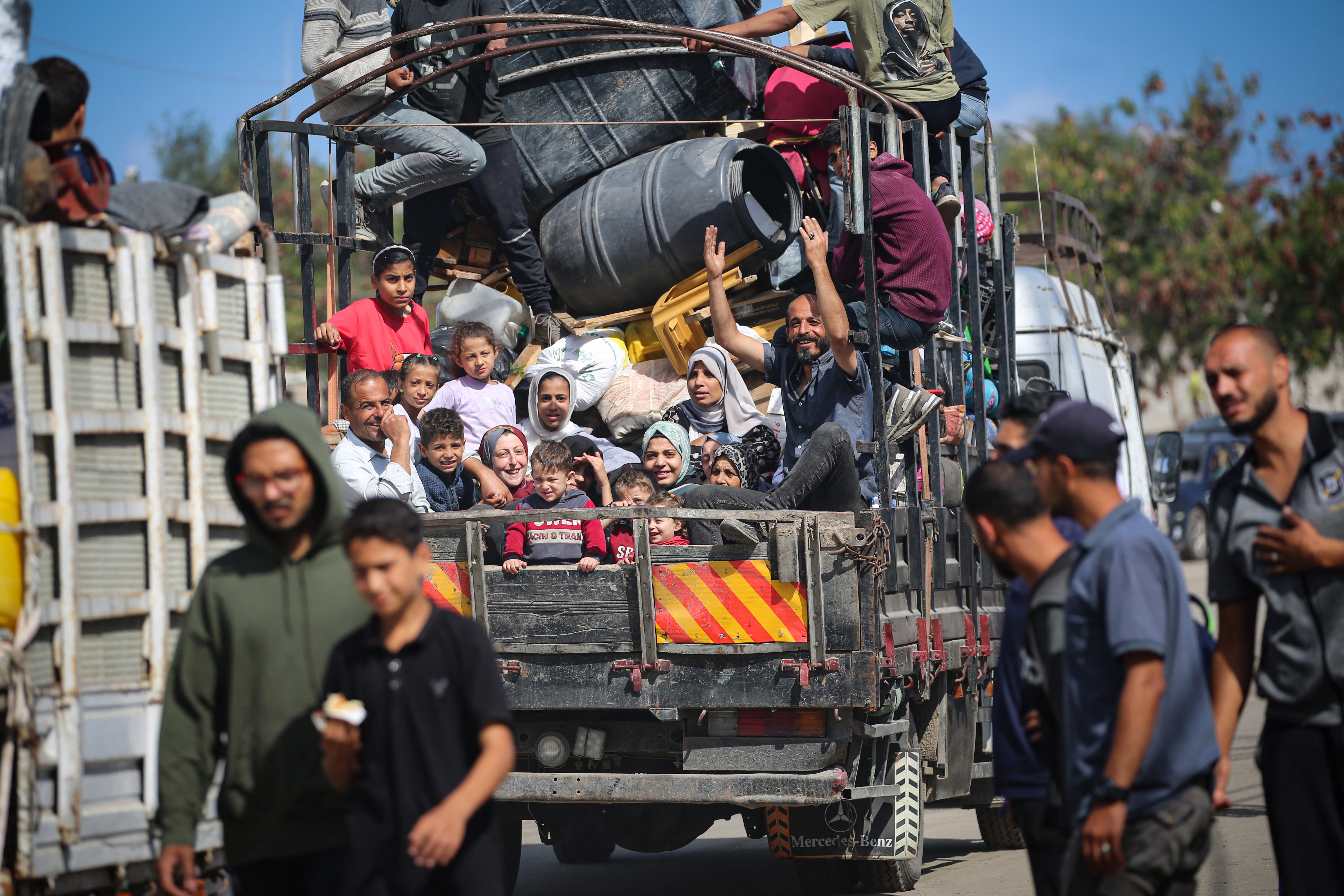 A Palestinian family, including several young children, are seen fleeing Rafah this morning
