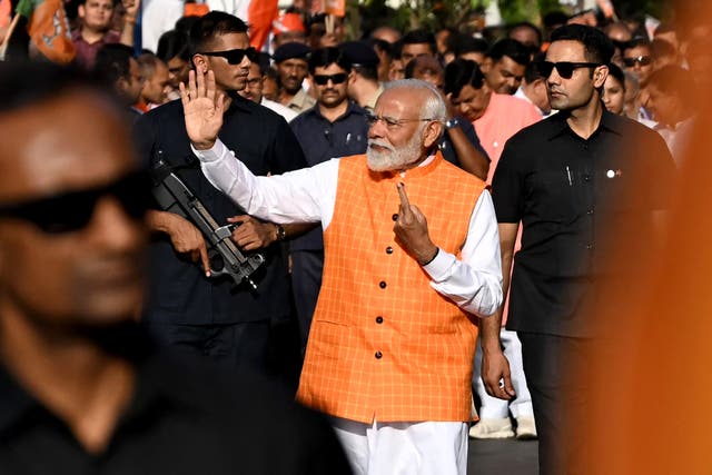 <p>Narendra Modi leaves after voting in the third phase of India’s election in Gujarat on 7 May 2024 </p>