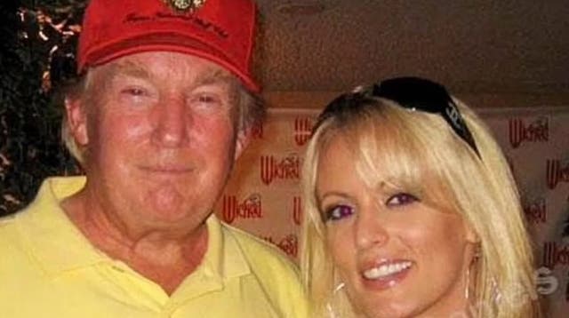 <p>Donald Trump pictured with Stormy Daniels at the 2006 golf tournament </p>