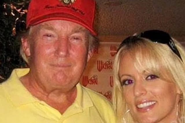 <p>Donald Trump pictured with Stormy Daniels at the 2006 golf tournament </p>