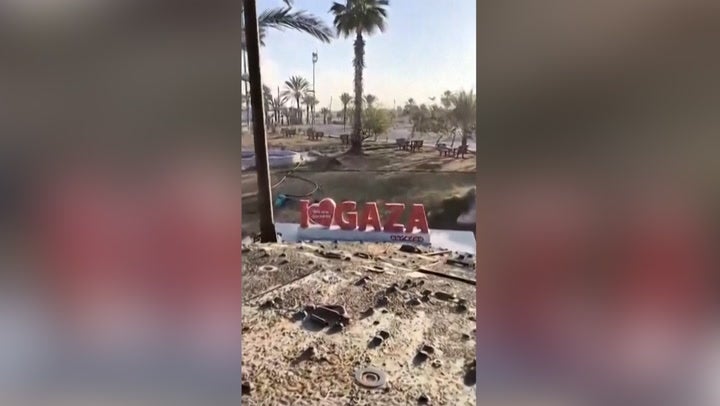 <p>Israeli tank drives over ‘I love Gaza’ sign as military takes control of Rafah crossing.</p>