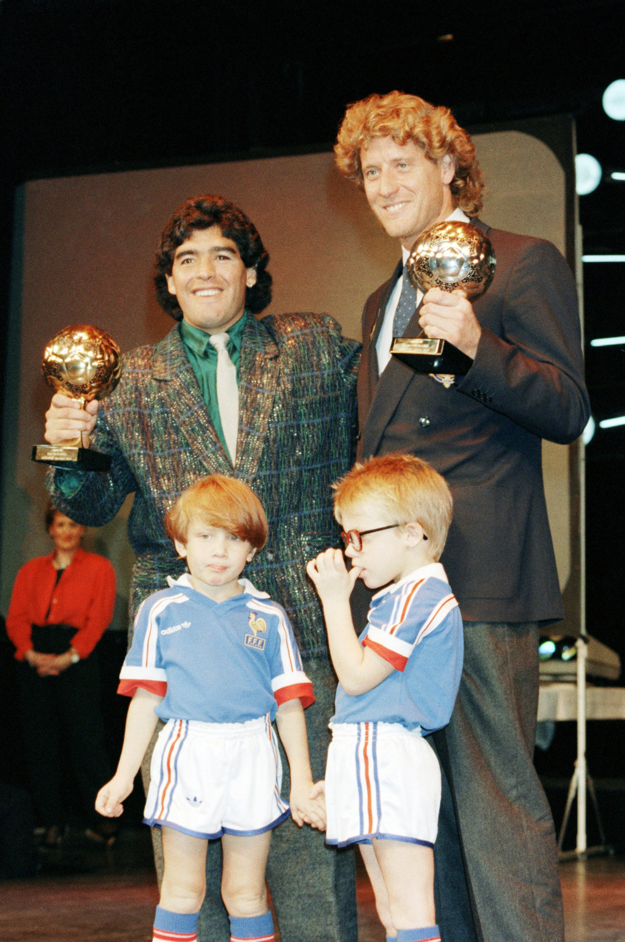 Diego Maradona, left, and West German goalkeeper Harald Schumacher are holding their World Cup awards