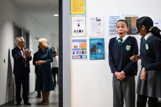 Pupils wait to see the Queen during a visit to Moreland Primary School in London (Justin Tallis/PA)