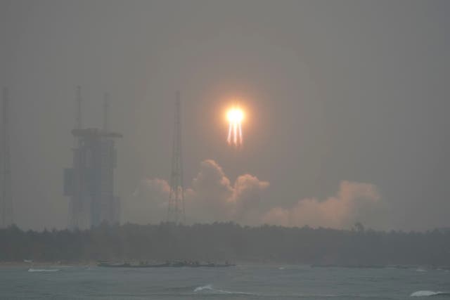 <p>A Long March 5 rocket, carrying the Chang’e-6 mission lunar probe, lifts off as it rains at the Wenchang Space Launch Centre in southern China’s Hainan Province on May 3, 2024</p>
