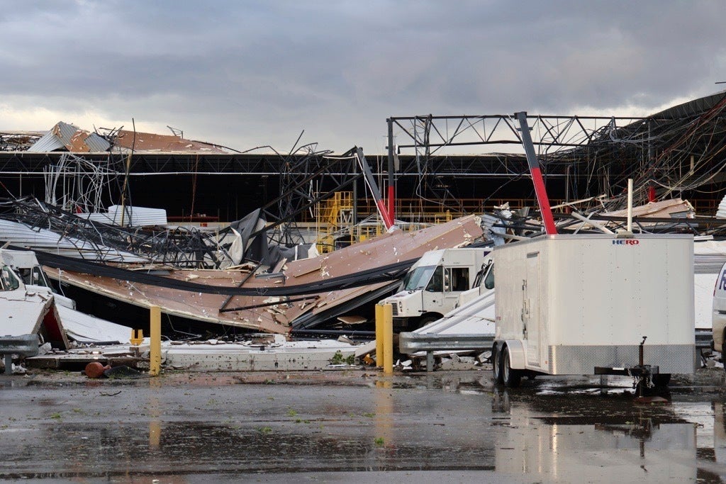 Debris is seen from a damaged FedEx facility after a tornado in Portage, Michigan, on Tuesday