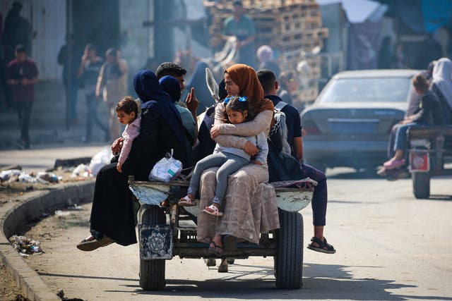 <p>Displaced Palestinians travel on a cart in Rafah, southern Gaza Strip</p>