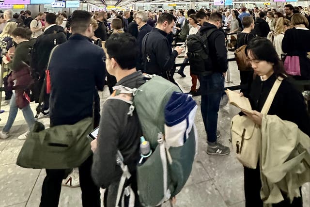 <p>Waiting game: British Airways passengers queuing for UK Border Force at Heathrow Terminal 5</p>