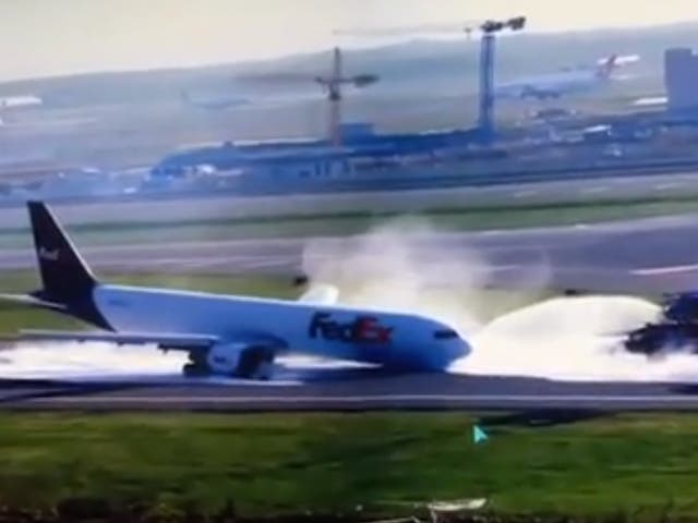 <p>Video footage showed sparks flying and smoke billowing as the front end of the plane scraped along the runway </p>
