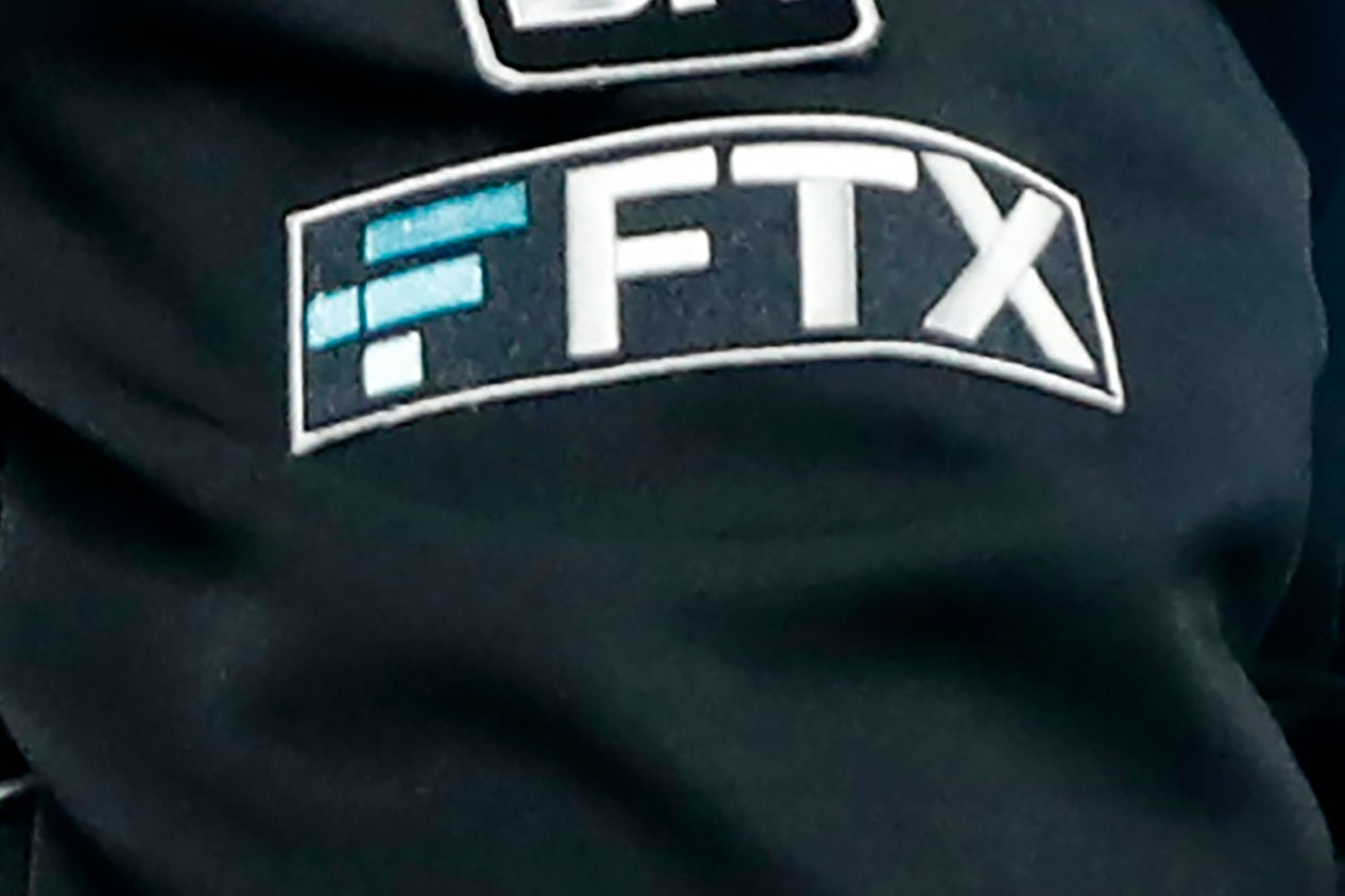 The FTX logo appears on home plate umpire Jansen Visconti's jacket at a baseball game with the Minnesota Twins on 27 September, 2022