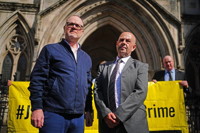 Journalists Trevor Birney, left, and Barry McCaffrey outside the Royal Courts of Justice, in London (Victoria Jones/PA)