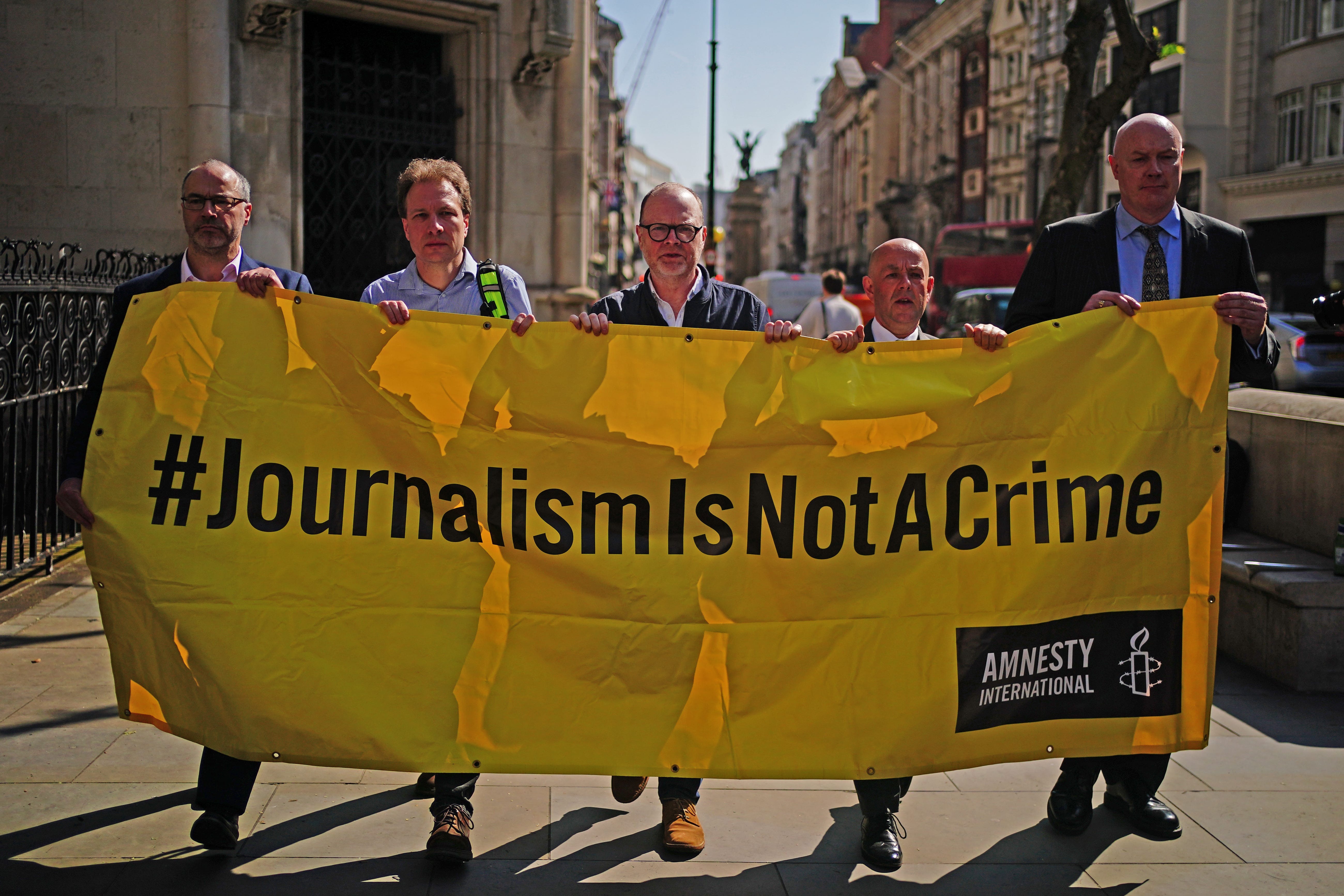 Supporters of journalists Barry McCaffrey and Trevor Birney, outside the Royal Courts of Justice in London, before their Investigatory Powers Tribunal (PA)