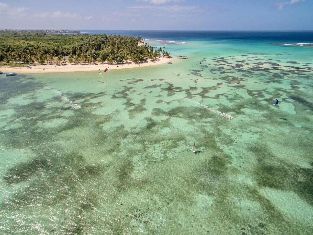 Start a day with a yoga session at Pigeon Point Beach, the most famous of Tobago’s beaches