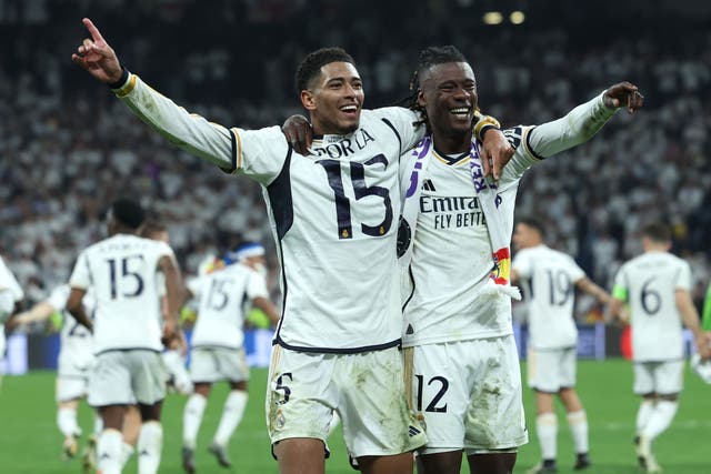 <p>Jude Bellingham, left, and Eduardo Camavinga celebrate as Real Madrid now target a 15th European Cup title at Wembley on June 1 (Isabel Infantes/PA)</p>