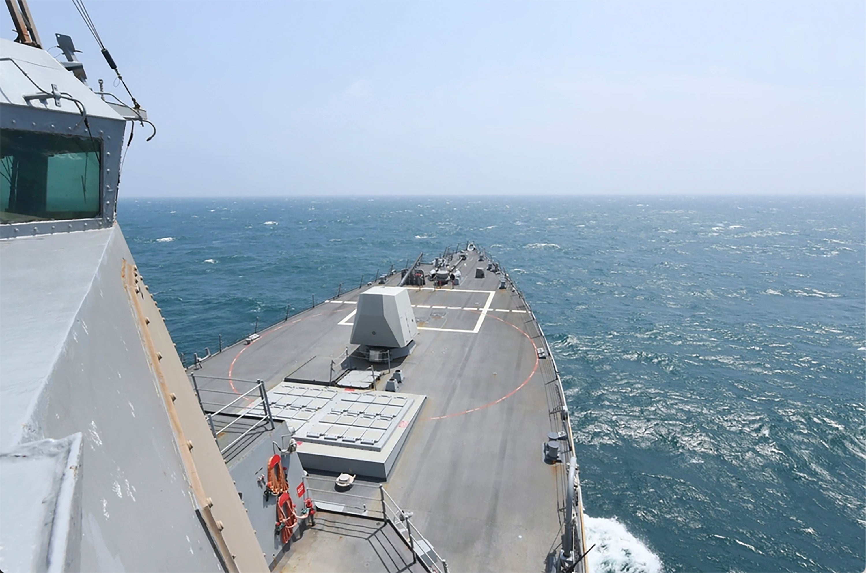 In this photo provided by the U.S. Navy, the Arleigh Burke-class guided-missile destroyer USS Halsey (DDG 97) conducts routine underway operations while transiting through the Taiwan Strait