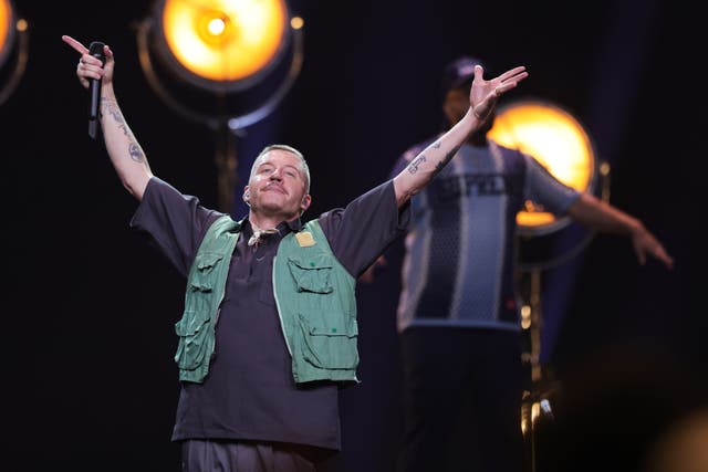 <p>Macklemore performs during the opening ceremony of the Invictus Games in 2023 </p>