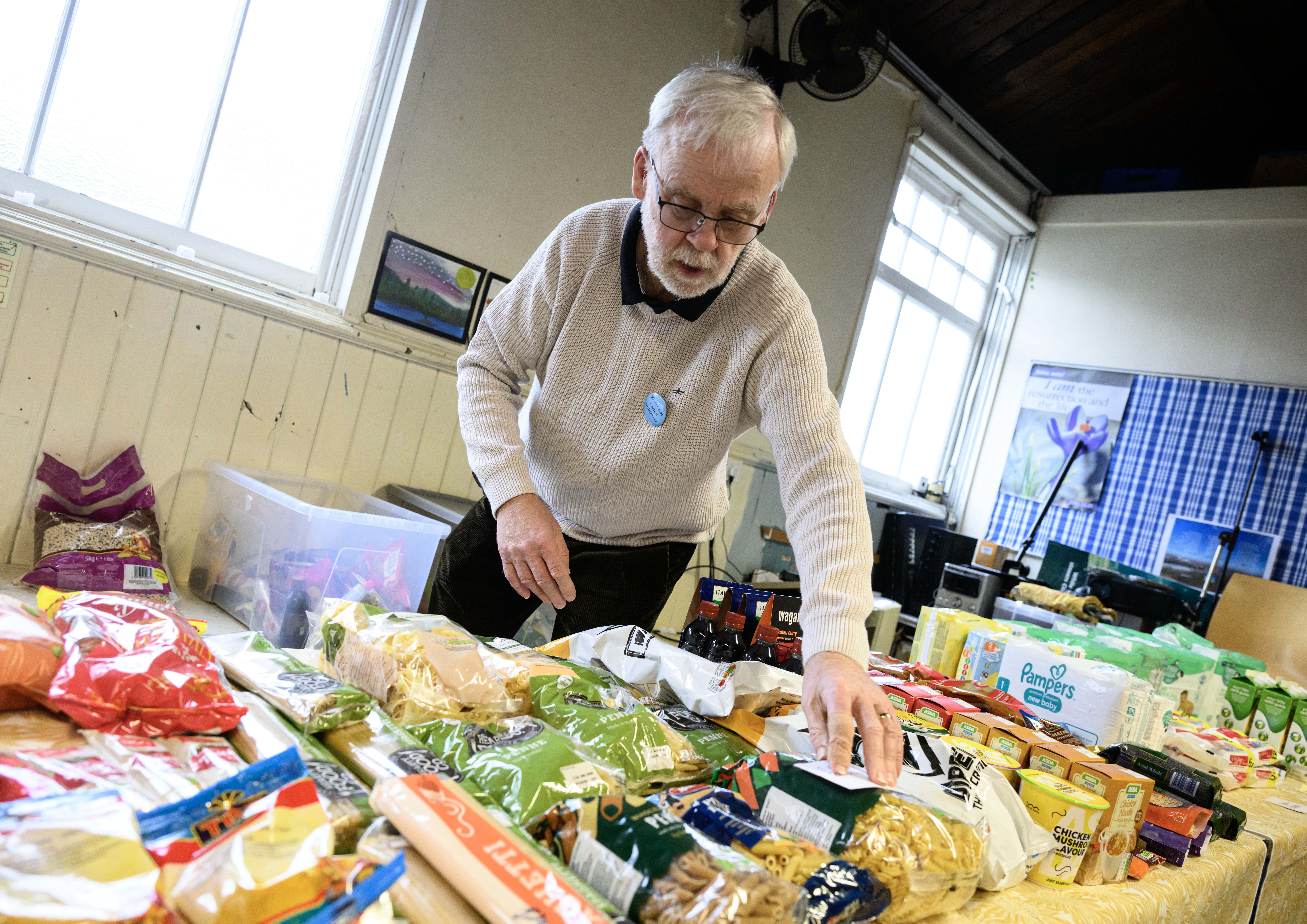 A volunteer at Bonny Downs Community Association food club during a March visit as part of Sainsbury's and Comic Relief's campaign to raise awareness of food poverty in the UK