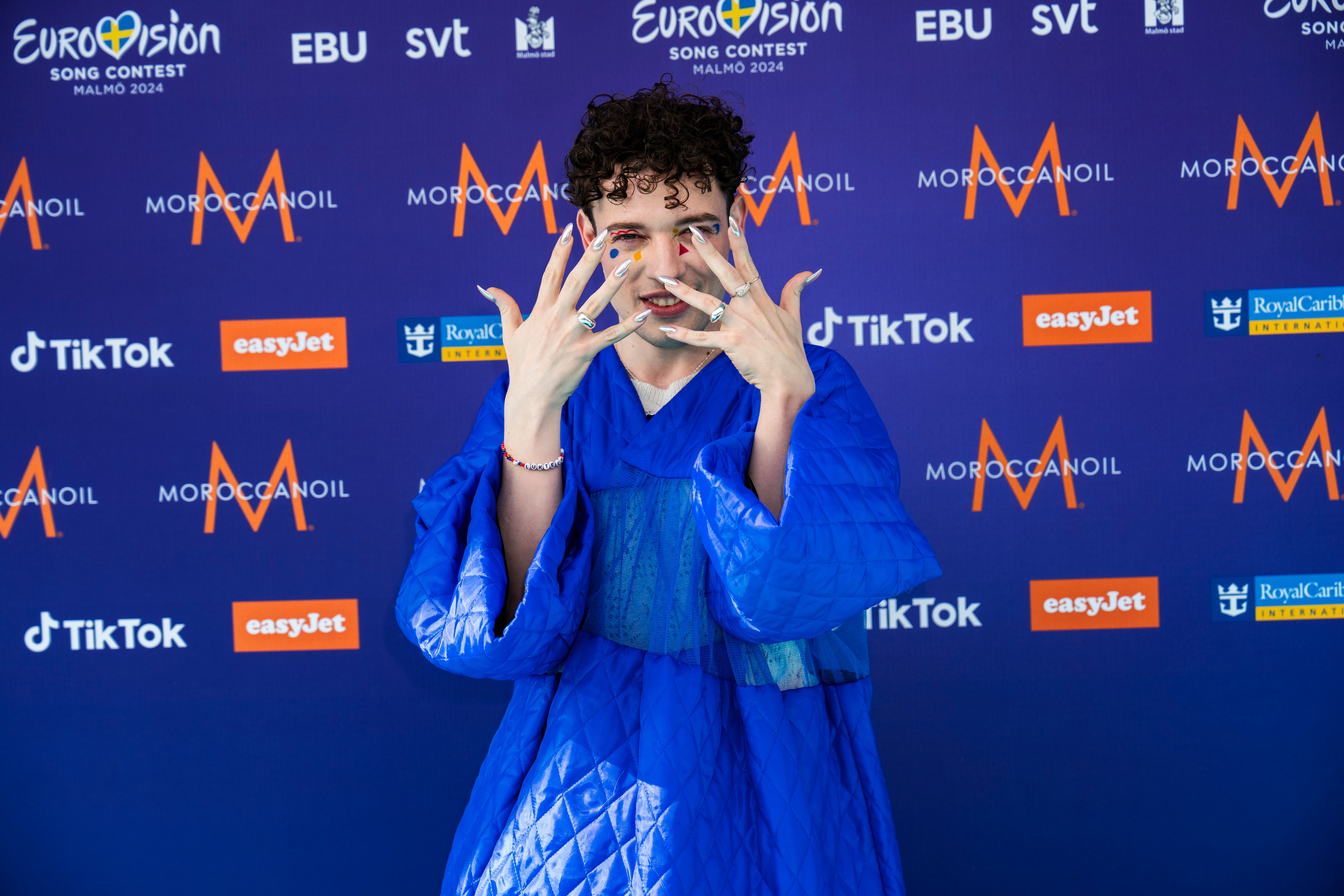 Nemo on the turquoise carpet at Eurovision 2024
