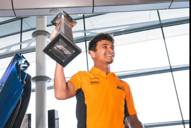<p>Lando Norris arrives back at McLaren HQ with his first-place trophy after his win in Miami </p>