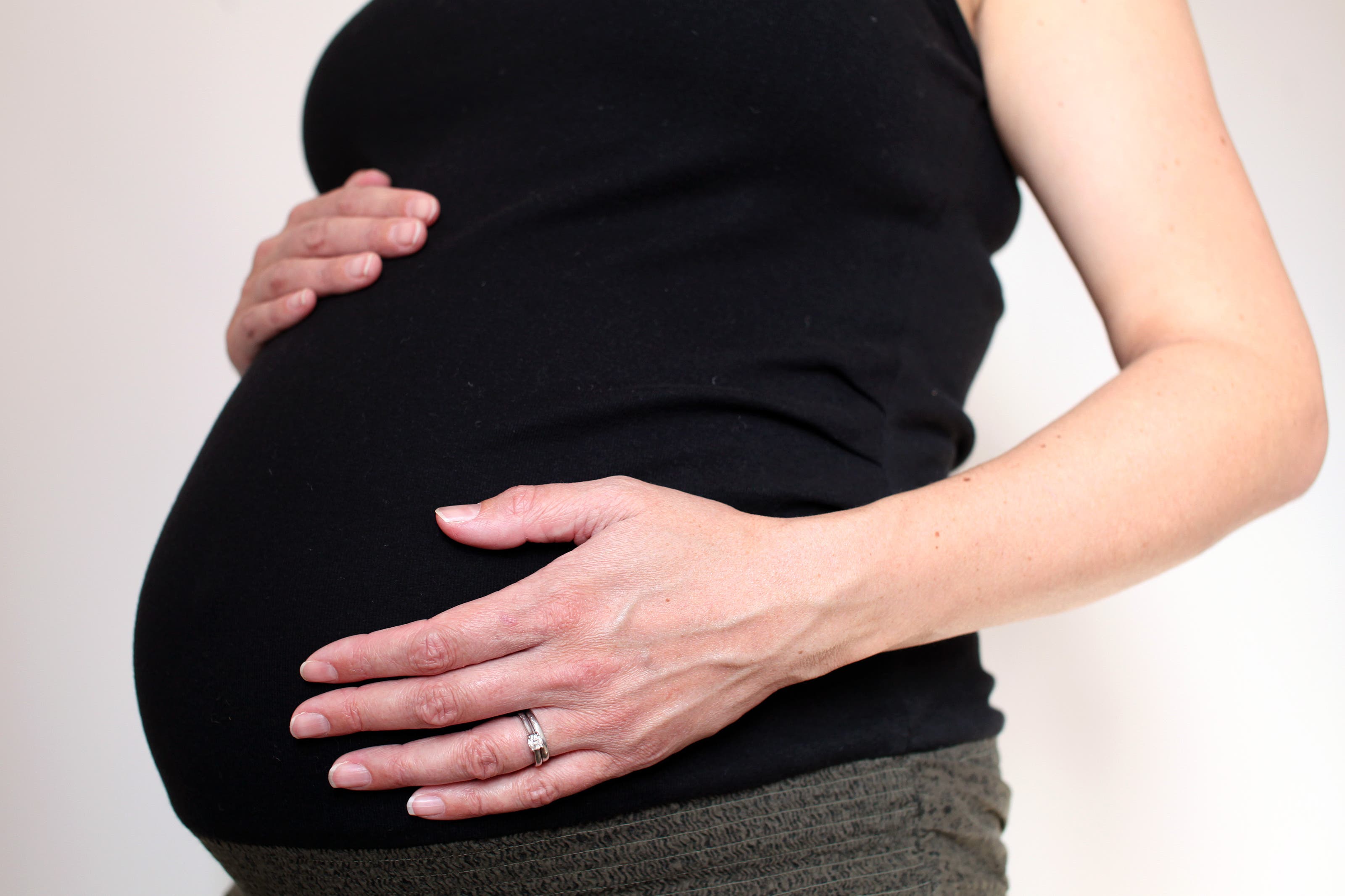 A pregnant woman hold her belly. Scientists across the country announced they have created the first-ever map of a human brain during the course of their pregnancy, finding revealing changes.