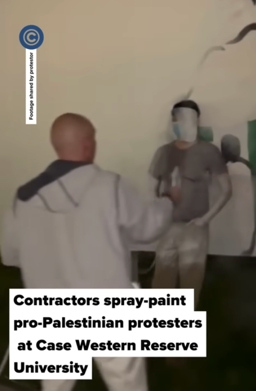 A contractor hired by Case Western Reserve University paints over a pro-Palestinian protester on 7 May. The next day, anti-war protesters occupied an administrative building on campus