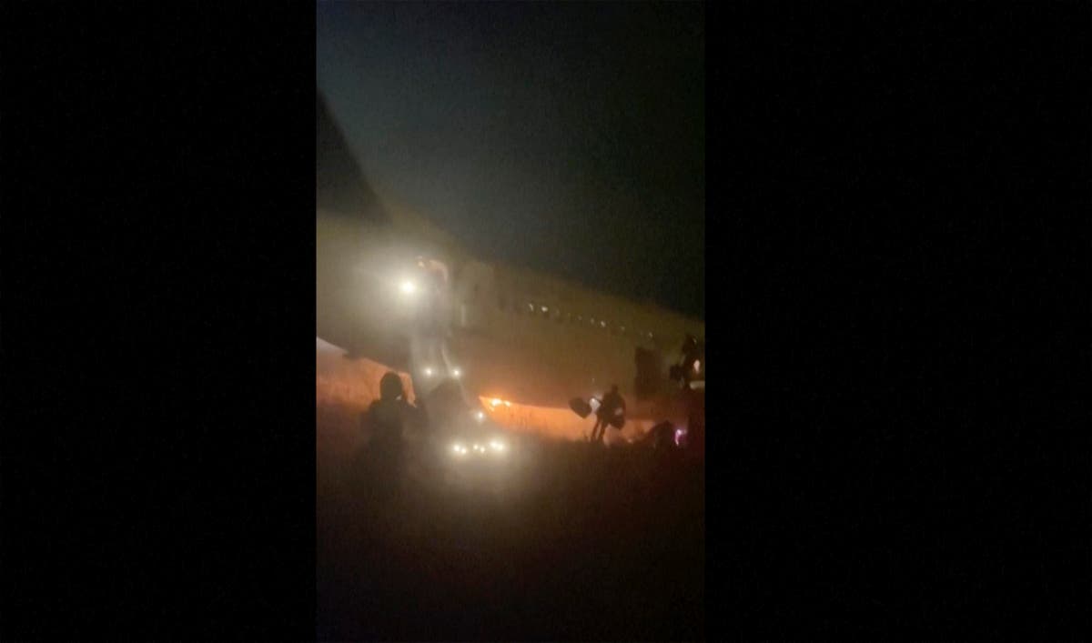 Boeing 737 catches fire and skids off the runway at a Senegal airport, injuring 10 people