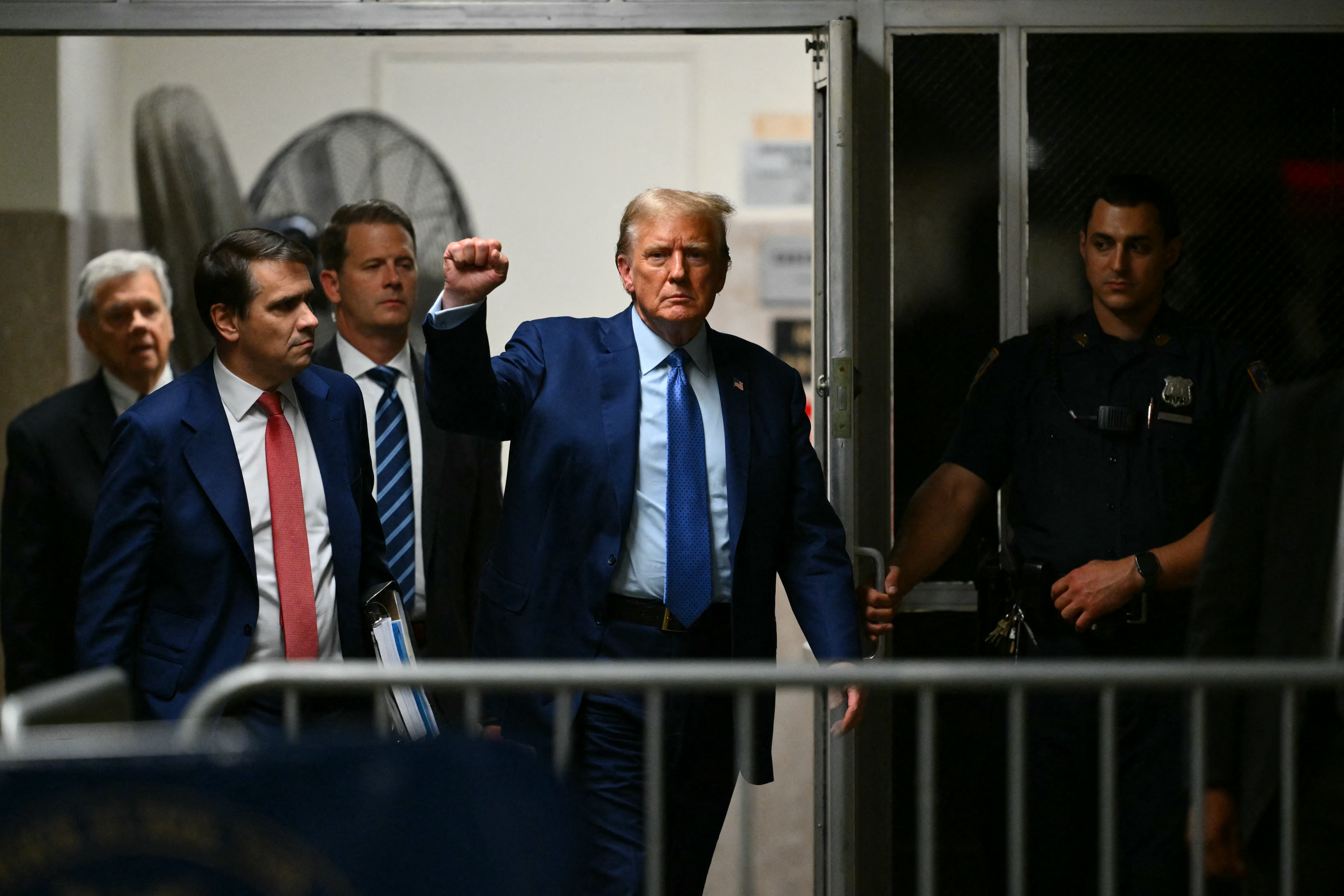 Donald Trump leaves a criminal courtroom in Manhattan on 9 May