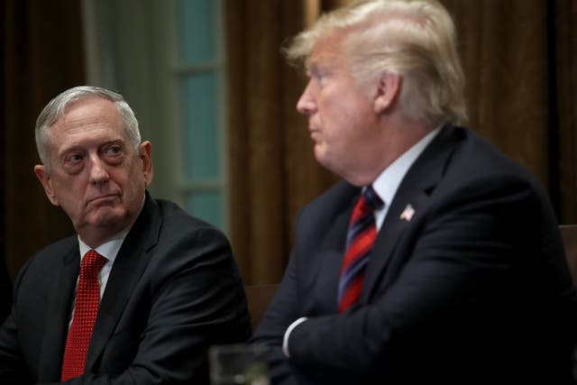 <p>Jim Mattis (left) and Donald Trump (right) speak at a 2018 press conference. Mr Mattis reportedly thought of Mr Trump as a ‘madman,’ a new book reveals</p>
