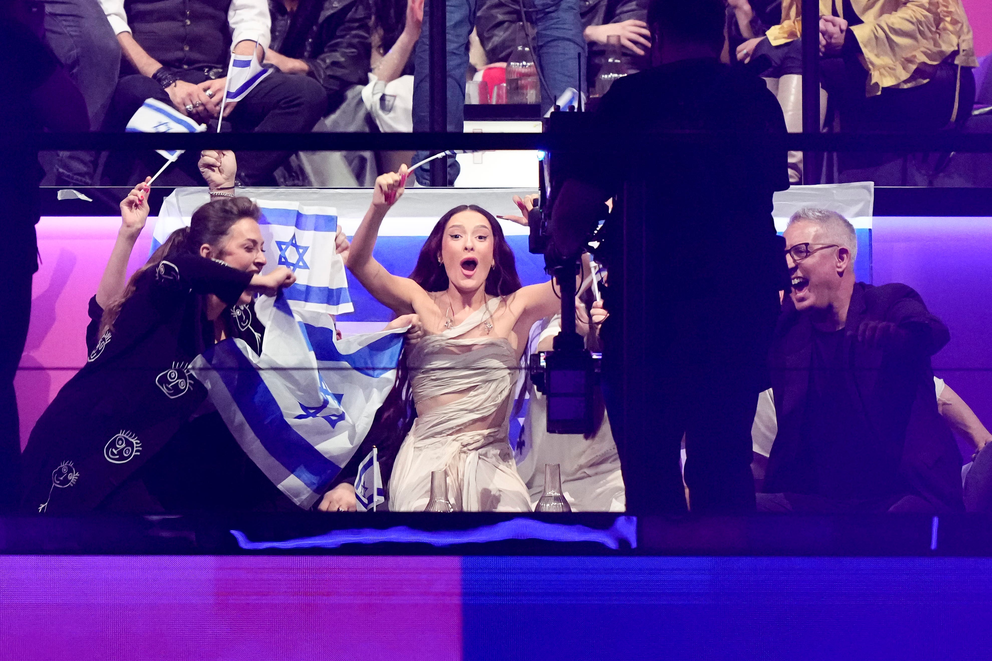 Eden Golan of Israel, centre, reacts as she is voted through to the Eurovision final