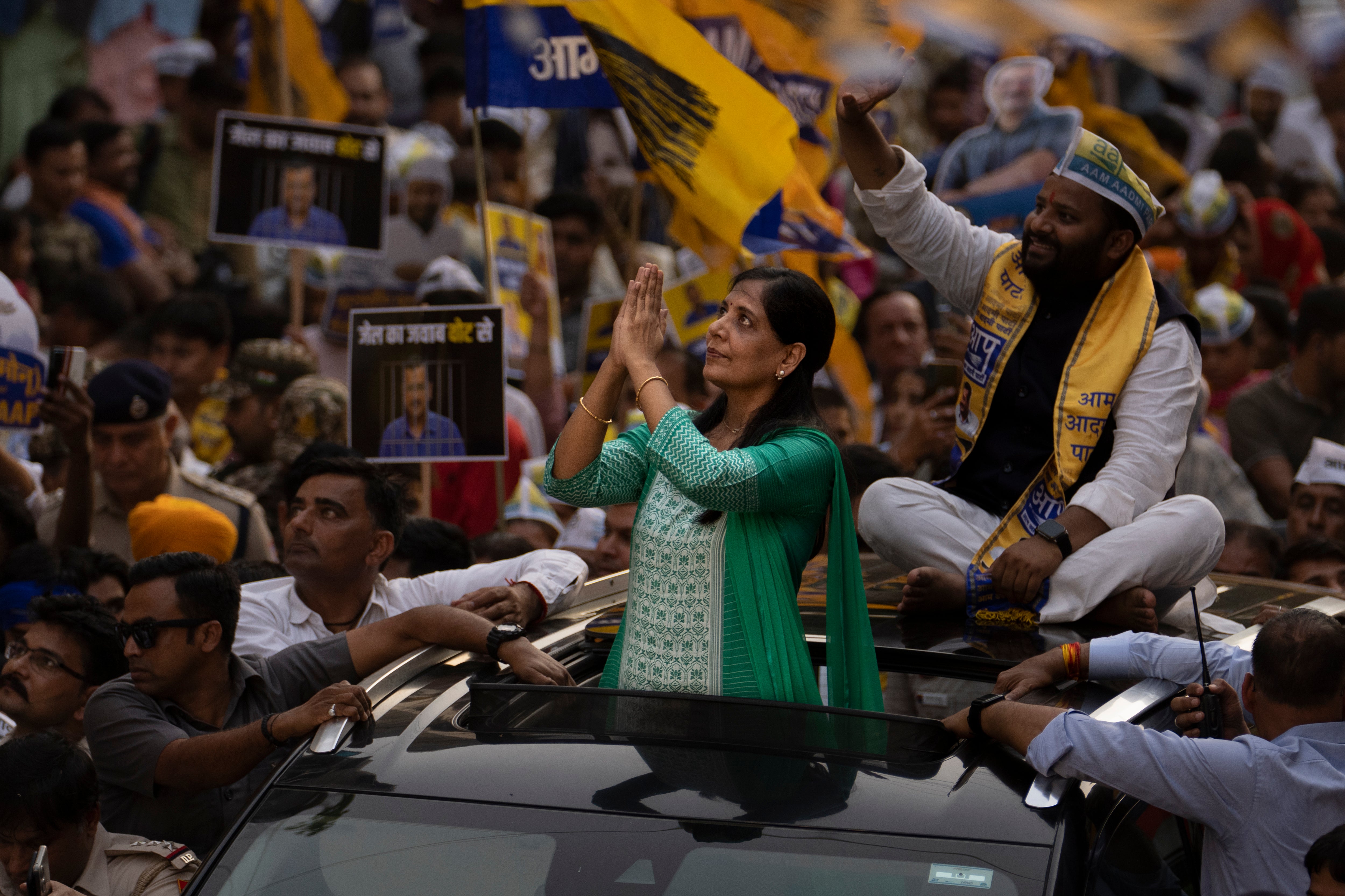 Sunita Kejriwal, wife of the jailed Aam Admi Party leader and Delhi Chief Minister Arvind Kejriwal, greets her supporters