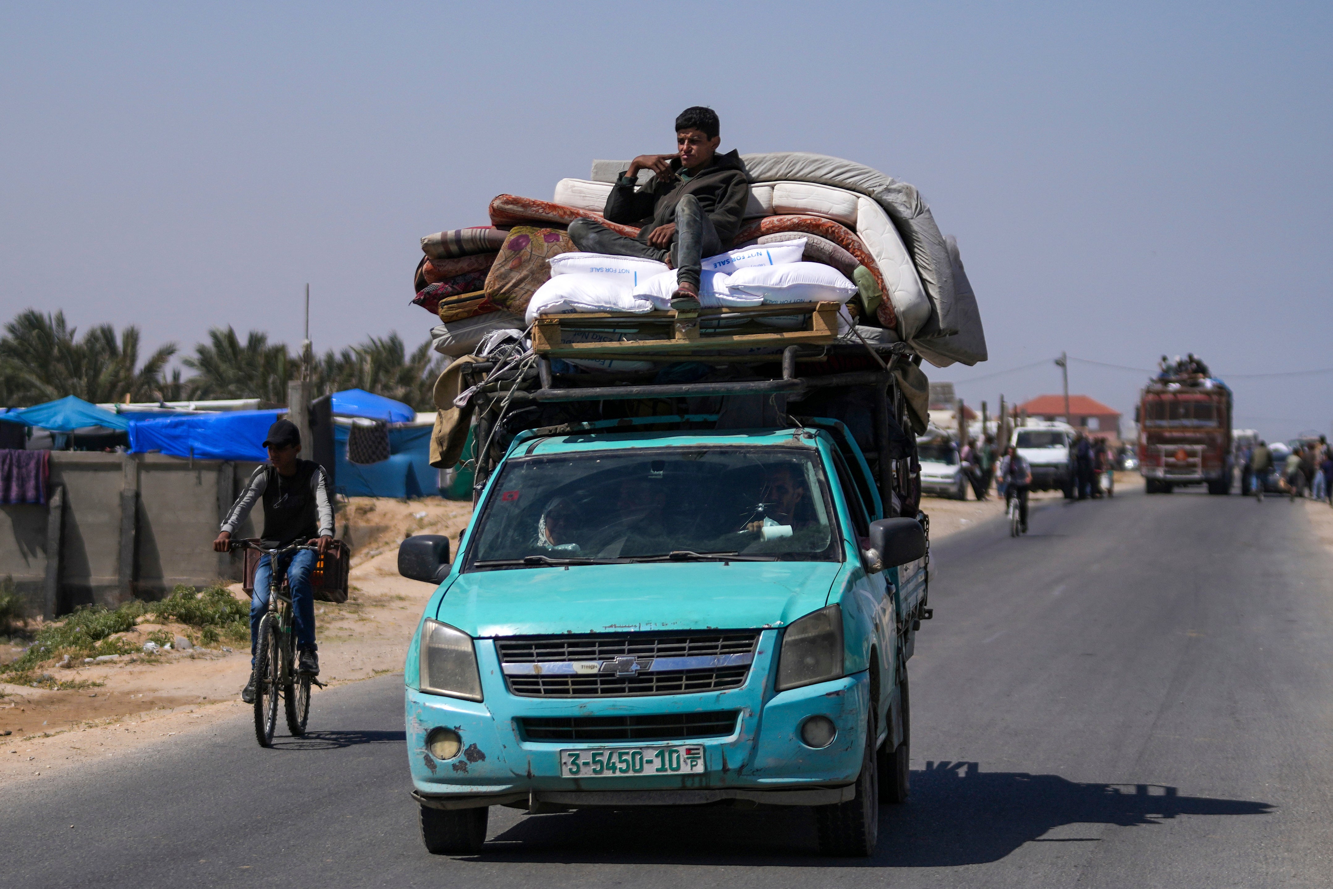 Displaced Palestinians arrive in central Gaza after fleeing from the southern Gaza city of Rafah