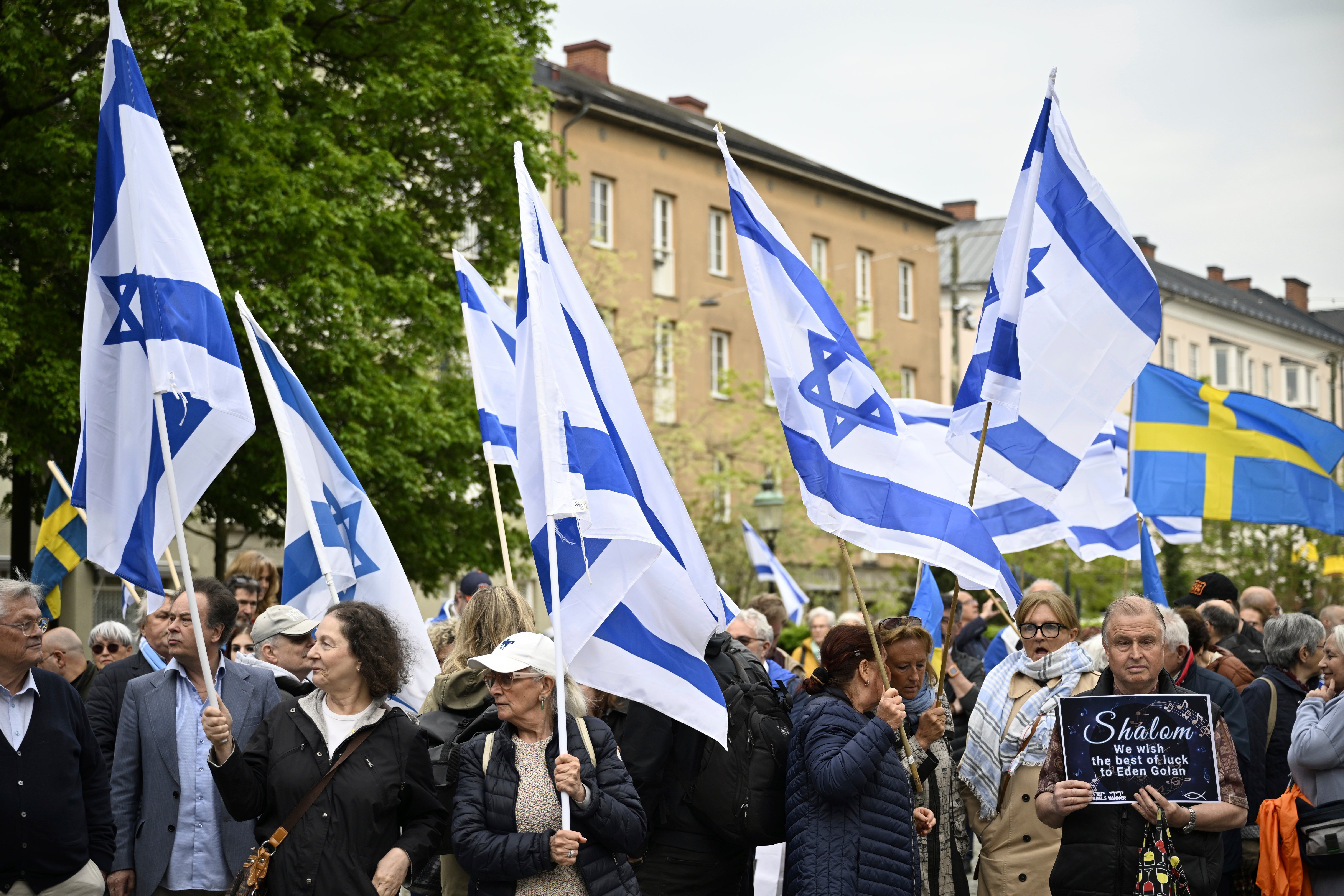 People carry Israeli and Swedish flags during a pro-Israel demonstration to pay tribute to Israel's Eurovision participant Eden Golan