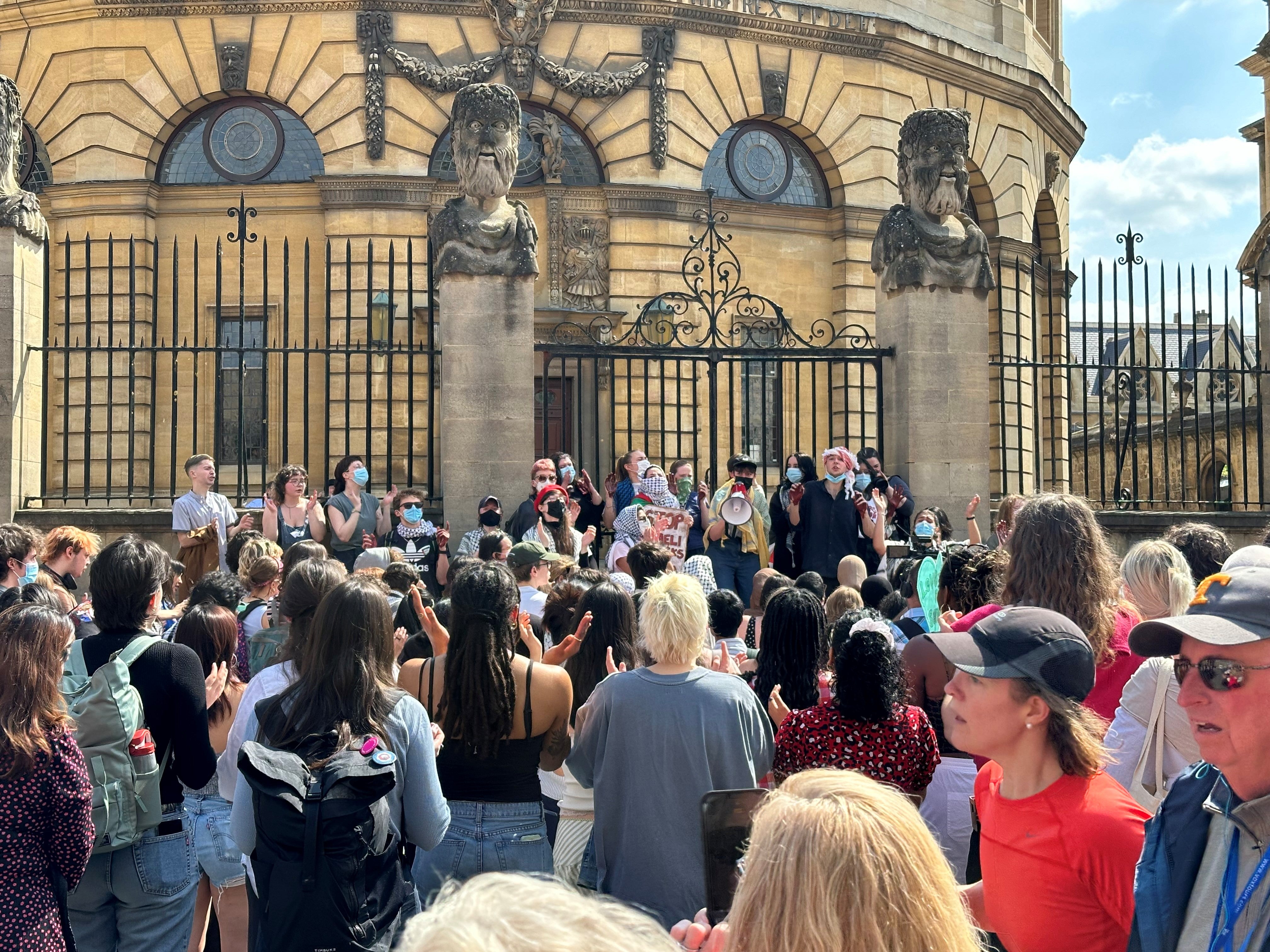 Protesters chant slogans outside the Sheldonian Theatre, as the vice-chancellor of Oxford University attended a ceremony