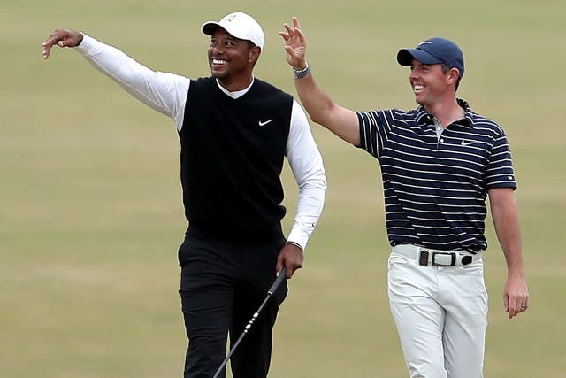 Rory McIlroy, right, has denied rumours of a fallout with Tiger Woods (Richard Sellers/PA)